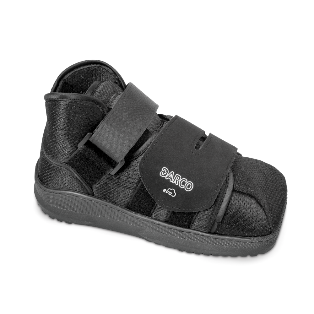 Black orthopedic shoe with velcro straps on a white background