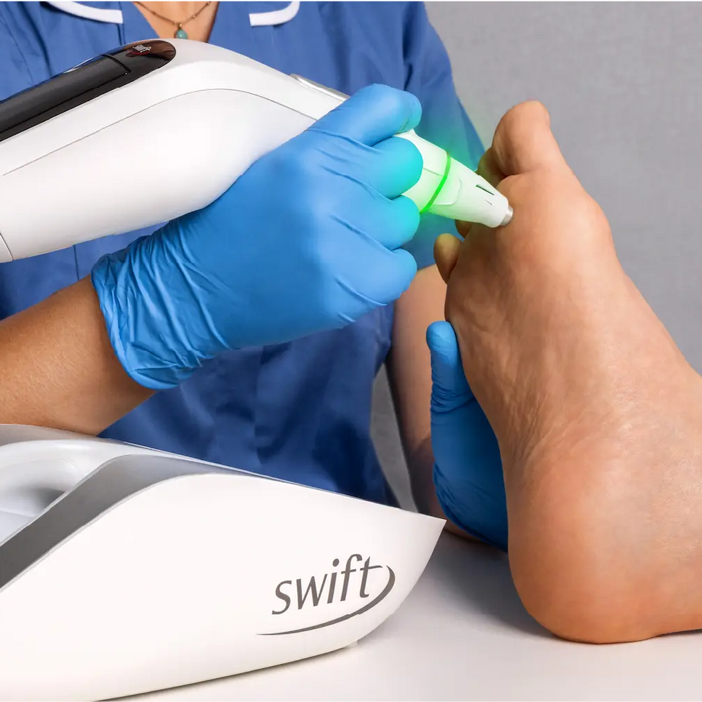 Swiftpro Unit being used for treatment on underside of patients foot